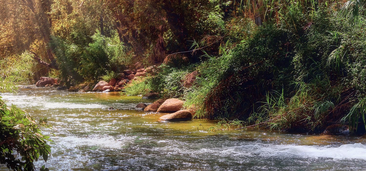 Water flowing down the Jordan River in the Prayer Garden